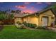 Charming single Gathering home with manicured landscaping and a one car garage at 1948 Elaine Dr, Clearwater, FL 33760