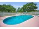 Community swimming pool with a fenced in area and seating available at 1948 Elaine Dr, Clearwater, FL 33760