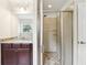 Bathroom featuring walk-in shower, vanity and tiled floors at 19711 Wellington Manor Blvd, Lutz, FL 33549