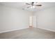 Spacious bedroom featuring neutral carpeting and a ceiling fan at 19711 Wellington Manor Blvd, Lutz, FL 33549