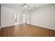 Spacious bedroom with multiple doorways and wood flooring at 19711 Wellington Manor Blvd, Lutz, FL 33549