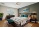 Staged bedroom featuring modern decor, neutral tones, and ample natural light at 19711 Wellington Manor Blvd, Lutz, FL 33549