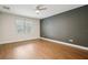 Bright bedroom with light-colored walls, and a ceiling fan at 19711 Wellington Manor Blvd, Lutz, FL 33549