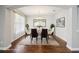 An elegant dining room showcases stylish furniture, chandelier, and wood flooring at 19711 Wellington Manor Blvd, Lutz, FL 33549