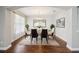 An elegant dining room showcases stylish furniture, chandelier, and wood flooring at 19711 Wellington Manor Blvd, Lutz, FL 33549