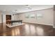 Spacious game room featuring hardwood floors, recessed lighting, pool table, and natural light at 19711 Wellington Manor Blvd, Lutz, FL 33549