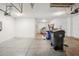Clean, well-lit garage with ample space for storage, tools, and vehicles at 19711 Wellington Manor Blvd, Lutz, FL 33549