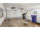 Spacious three-car garage with ample storage, shelving, and room for vehicles and projects at 19711 Wellington Manor Blvd, Lutz, FL 33549