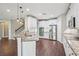 Bright kitchen features granite countertops, stainless steel appliances, and white cabinetry at 19711 Wellington Manor Blvd, Lutz, FL 33549