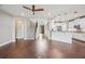 Spacious open-concept living area with staircase and kitchen at 19711 Wellington Manor Blvd, Lutz, FL 33549