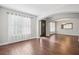 This well-lit living room has gray walls and wood floors at 19711 Wellington Manor Blvd, Lutz, FL 33549