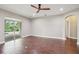 Open-concept living room with sliding doors to the backyard at 19711 Wellington Manor Blvd, Lutz, FL 33549