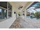 Extended covered patio overlooking a screened pool, perfect for year-round outdoor enjoyment at 19711 Wellington Manor Blvd, Lutz, FL 33549