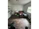 A bedroom features hardwood floors, one window, and a bed frame with a mattress at 201 Lentz Rd, Brandon, FL 33510