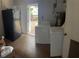 An interior utility room features a washer, dryer, water heater, and fridge at 201 Lentz Rd, Brandon, FL 33510