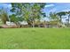 Expansive backyard with a well-kept lawn, perfect for outdoor activities and gatherings with an outdoor grilling station at 206 4Th Nw Ave, Ruskin, FL 33570