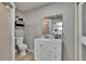 Neutral bathroom with white vanity, mirror, and tile shower at 206 4Th Nw Ave, Ruskin, FL 33570
