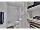 Cozy bathroom featuring a shower with curtain and organized shelving with towels and toiletries at 206 4Th Nw Ave, Ruskin, FL 33570