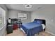 Bedroom with desk, computer, and blue comforter and ceiling fan at 206 4Th Nw Ave, Ruskin, FL 33570