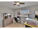 Bedroom with neutral floors, storage bins, makeup vanity, and window at 206 4Th Nw Ave, Ruskin, FL 33570