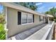 Charming single-story home with exterior, stone path and mature trees at 206 4Th Nw Ave, Ruskin, FL 33570