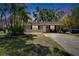 Charming single-story home with front yard, well-maintained lawn, and mature trees at 206 4Th Nw Ave, Ruskin, FL 33570