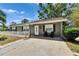 Charming single-story home with front yard, well-maintained lawn, and mature trees at 206 4Th Nw Ave, Ruskin, FL 33570