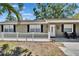 Charming single-story home with front yard, well-maintained lawn, and mature trees at 206 4Th Nw Ave, Ruskin, FL 33570