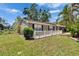 Charming single-story home with front yard, well-maintained lawn, and mature trees at 206 4Th Nw Ave, Ruskin, FL 33570