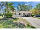 Charming single-story home with front yard, well-maintained lawn, and mature trees at 206 4Th Nw Ave, Ruskin, FL 33570
