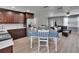Kitchen view with stainless appliances, wooden cabinets, and a modern dining set at 206 4Th Nw Ave, Ruskin, FL 33570