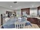 Bright kitchen with a coffee bar, stainless steel appliances, and outdoor access at 206 4Th Nw Ave, Ruskin, FL 33570