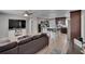 Bright living room with sleek wood floors, with a kitchen and dining area in the background at 206 4Th Nw Ave, Ruskin, FL 33570