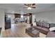 Open concept living room and kitchen featuring wood flooring and stainless steel appliances at 206 4Th Nw Ave, Ruskin, FL 33570