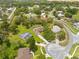 An expansive aerial view of the neighborhood showing lush greenery and winding roads at 206 Forest Wood Ct, Spring Hill, FL 34609