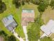 An aerial view reveals this home's pool, backyard, and location amongst other lovely homes at 206 Forest Wood Ct, Spring Hill, FL 34609
