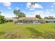 A screened-in pool encloses the back of this single story home at 206 Forest Wood Ct, Spring Hill, FL 34609