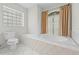 Bright bathroom featuring a soaking tub and a separate glass block window for natural light at 206 Forest Wood Ct, Spring Hill, FL 34609