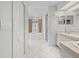 Bright bathroom featuring dual sinks, walk-in shower, and a luxurious soaking tub with natural light at 206 Forest Wood Ct, Spring Hill, FL 34609