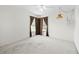 Cozy bedroom featuring soft carpet, natural light from windows, and simple decor at 206 Forest Wood Ct, Spring Hill, FL 34609