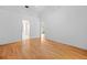 Spacious bedroom with hardwood floors and doorways leading to a bathroom and another room at 206 Forest Wood Ct, Spring Hill, FL 34609