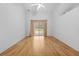 Bright, airy bedroom with hardwood floors and sliding glass doors to the backyard offering serene views at 206 Forest Wood Ct, Spring Hill, FL 34609