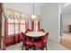 Bright dining area with tile floors, marble table, and ornate chairs at 206 Forest Wood Ct, Spring Hill, FL 34609