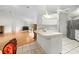 Bright kitchen with stainless appliances and a spacious layout connected to the dining and living areas at 206 Forest Wood Ct, Spring Hill, FL 34609