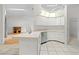 Modern kitchen offers ample cabinet space, a stainless steel dishwasher, and natural light from the skylight at 206 Forest Wood Ct, Spring Hill, FL 34609