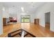 Spacious living room with hardwood floors and a view of the backyard pool area at 206 Forest Wood Ct, Spring Hill, FL 34609