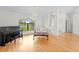 Inviting living room with hardwood floors, a large window, and elegant furnishings at 206 Forest Wood Ct, Spring Hill, FL 34609