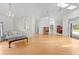 Bright and open living room with hardwood floors and views of the backyard and dining area at 206 Forest Wood Ct, Spring Hill, FL 34609