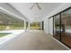 Spacious covered patio area with views of the pool, perfect for entertaining and relaxing at 206 Forest Wood Ct, Spring Hill, FL 34609
