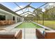Beautiful screened-in pool and extended patio offer seamless indoor-outdoor living at 206 Forest Wood Ct, Spring Hill, FL 34609